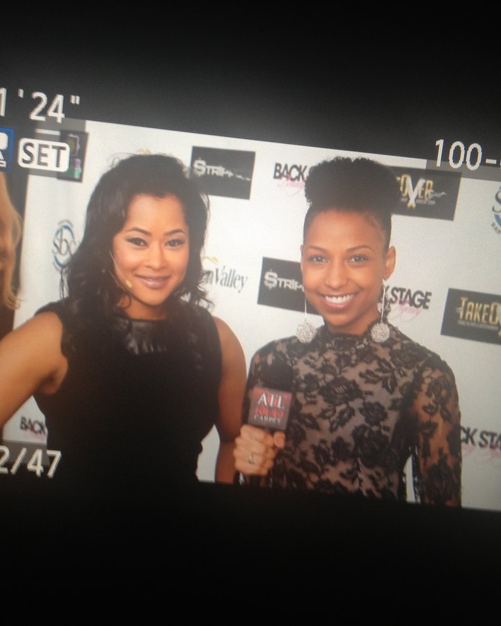 A camera viewfinder framing Chelsea during a red carpet interview