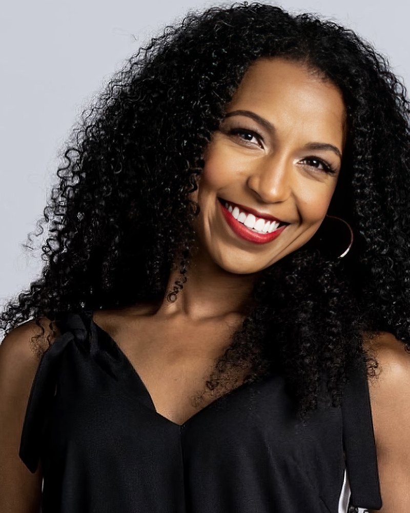 Studio headshot of Chelsea smiling