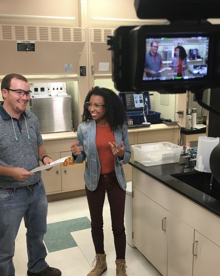 Chelsea hosting an indoor segment for the Georgia Forestry series while the camera monitor frames the shot